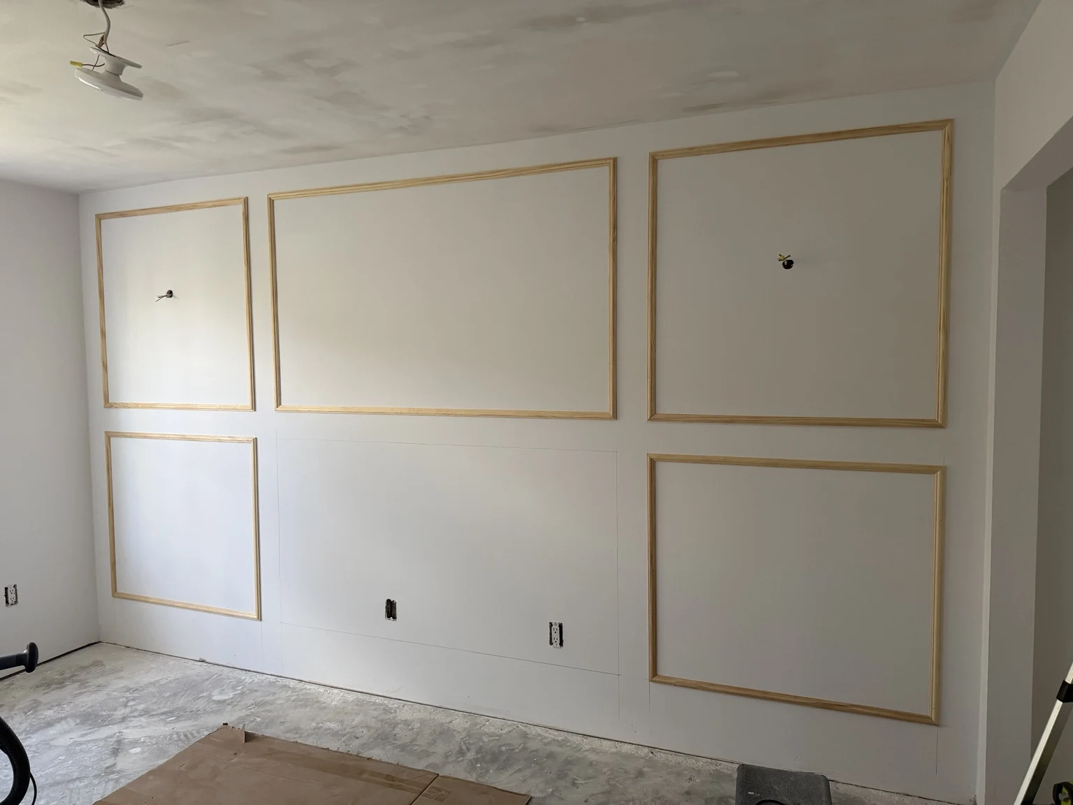 Decorative rectangular wall moulding during installation