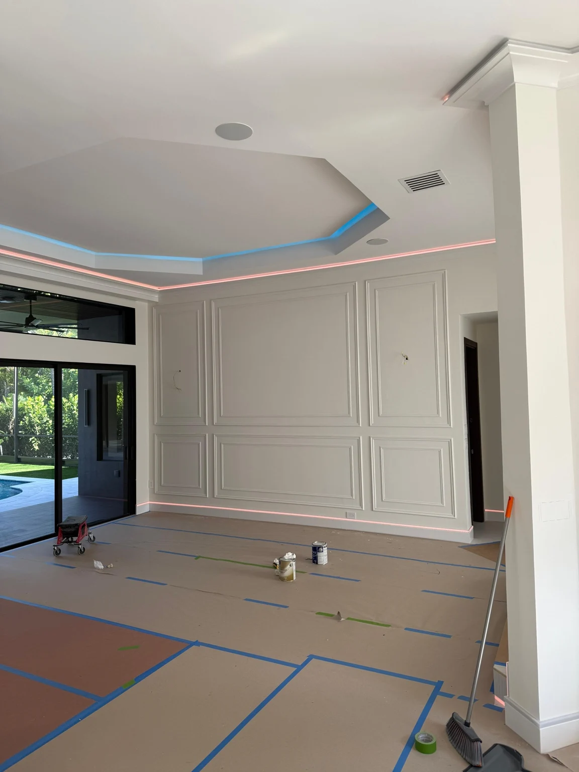 Decorative wall panels and ceiling lighting during finishing work